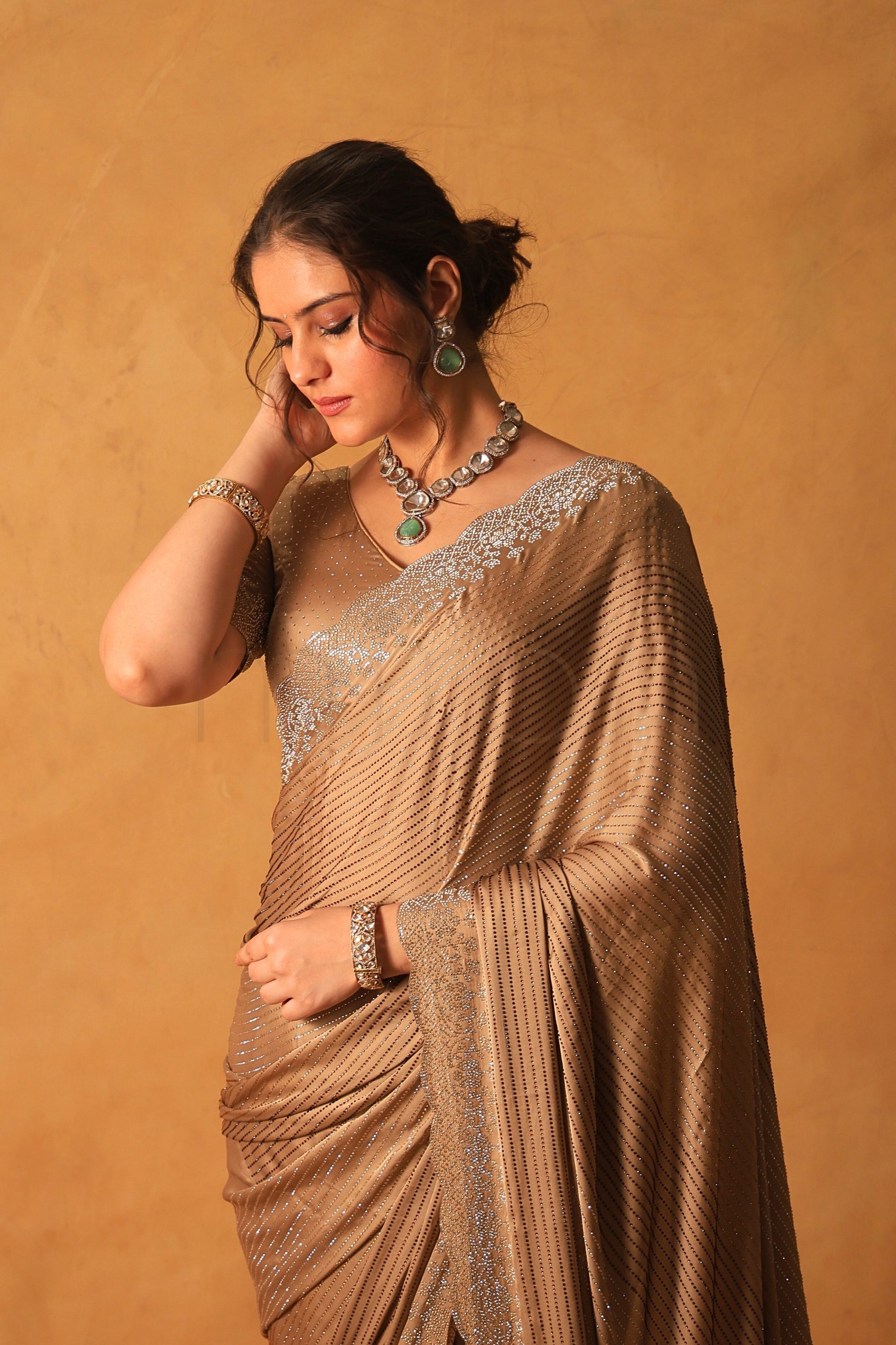 Chikoo Gold Satin Saree with Swarovski & Jarkan Stone Embellishments