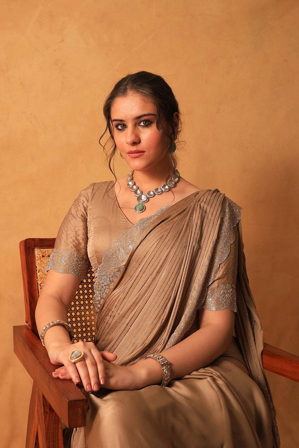 Chikoo Gold Satin Saree with Swarovski & Jarkan Stone Embellishments