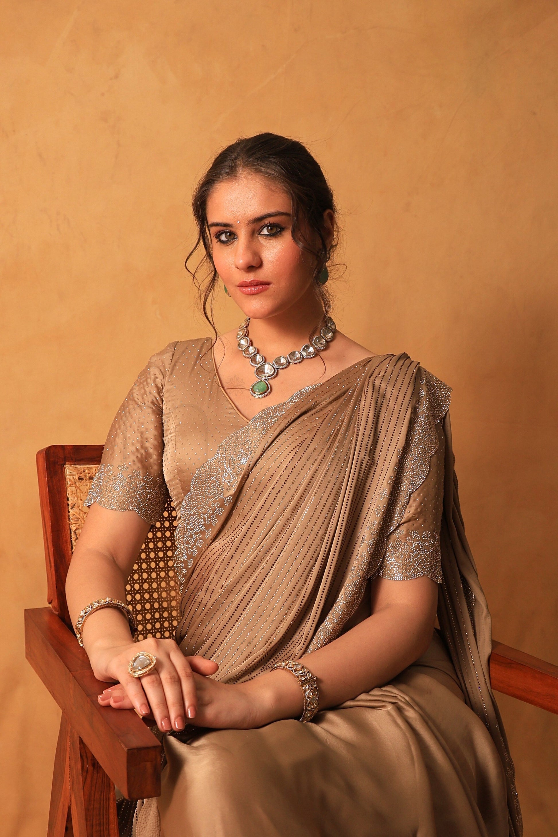 Chikoo Gold Satin Saree with Swarovski & Jarkan Stone Embellishments