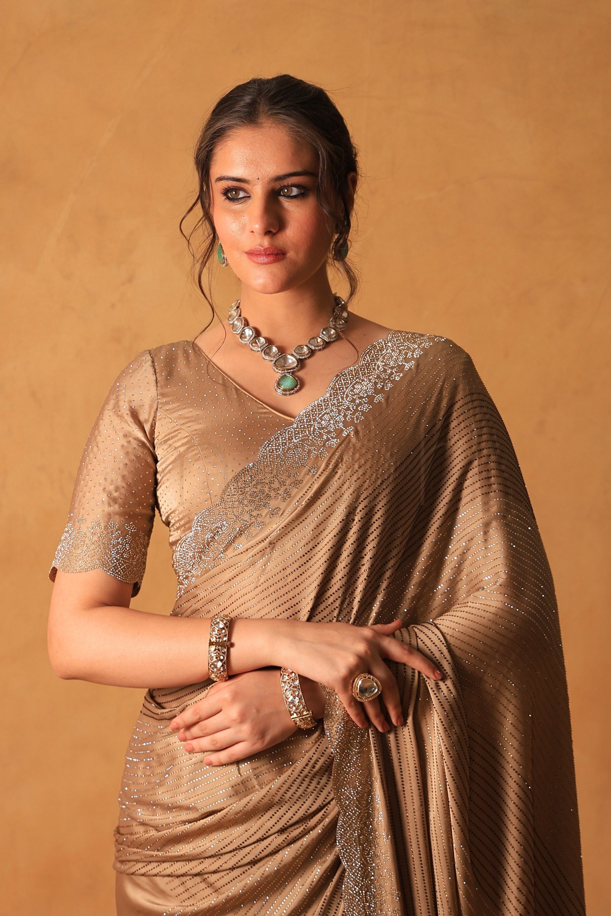 Chikoo Gold Satin Saree with Swarovski & Jarkan Stone Embellishments