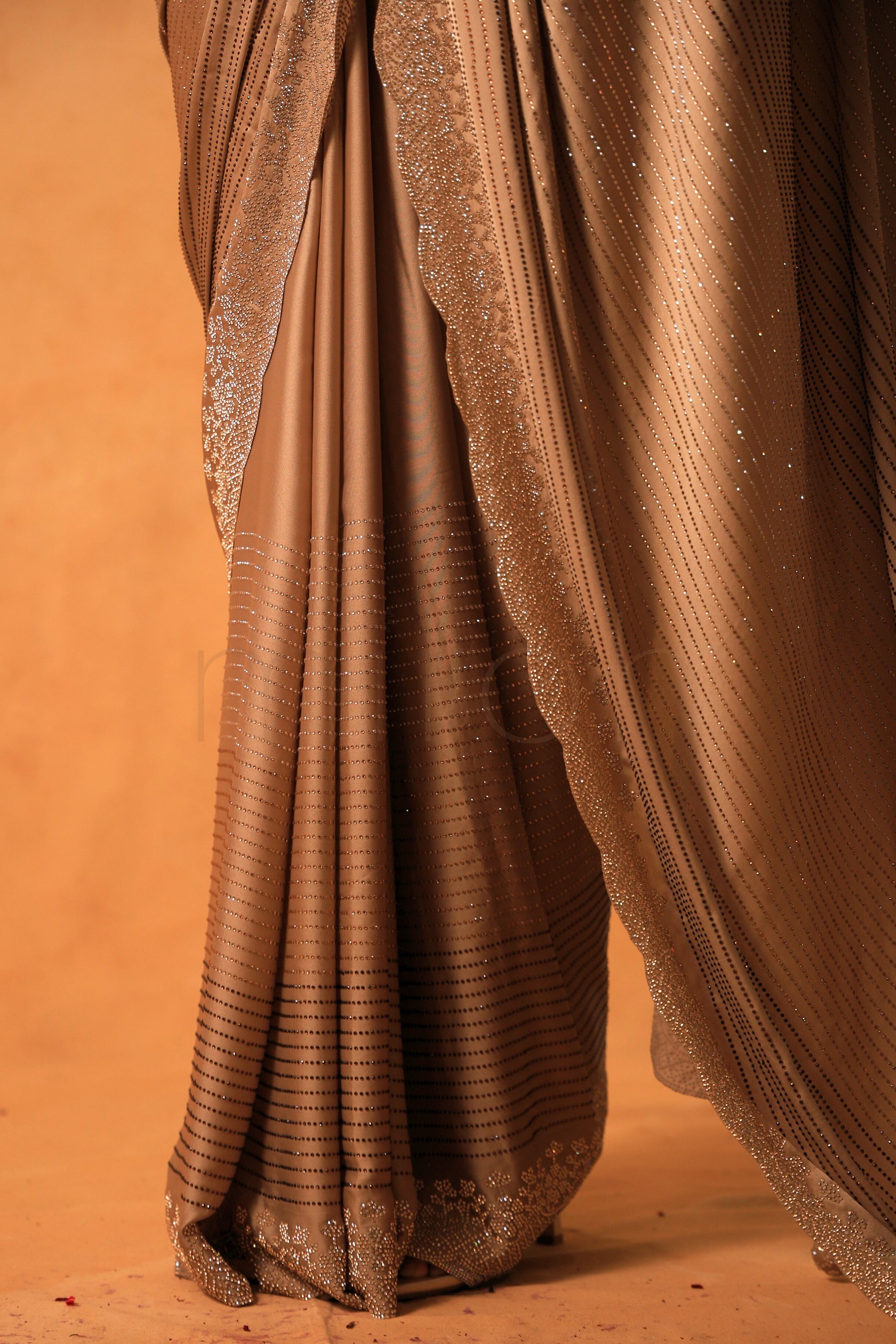 Chikoo Gold Satin Saree with Swarovski & Jarkan Stone Embellishments